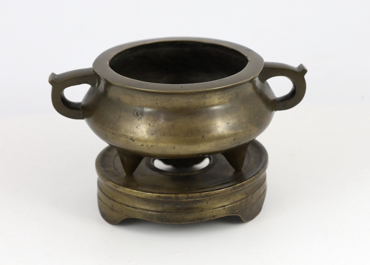 A Chinese bronze censer and stand, ding, 18th/19th century, 18.7cm wide, 11cm high